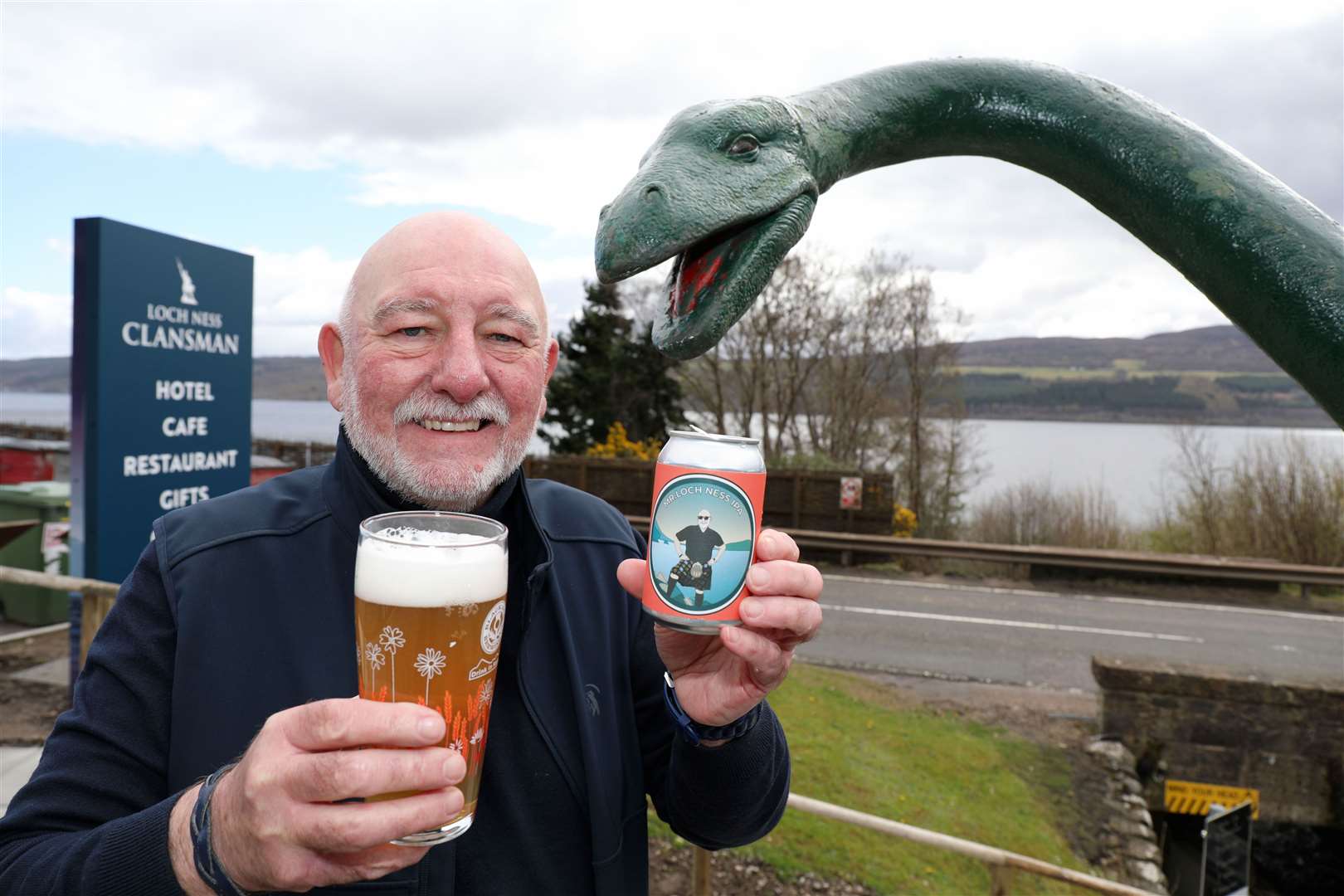 Willie Cameron on Loch Ness-side with the new ale and model "monster." Pic Peter Jolly