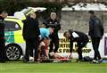 Ambulance drives on to pitch during Highland League game to treat player's head injury