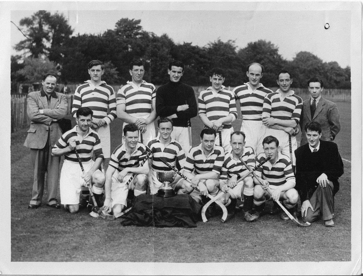 Behind the trophy, Denis Swanson as Torlundy Cup winning captain in 1951. he scored the winning goal against Oban Celtic.