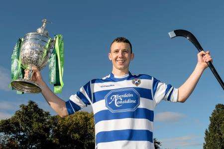 Newtonmore captain Rory Kennedy with the Camanachd Cup. Picture: Neil Paterson.