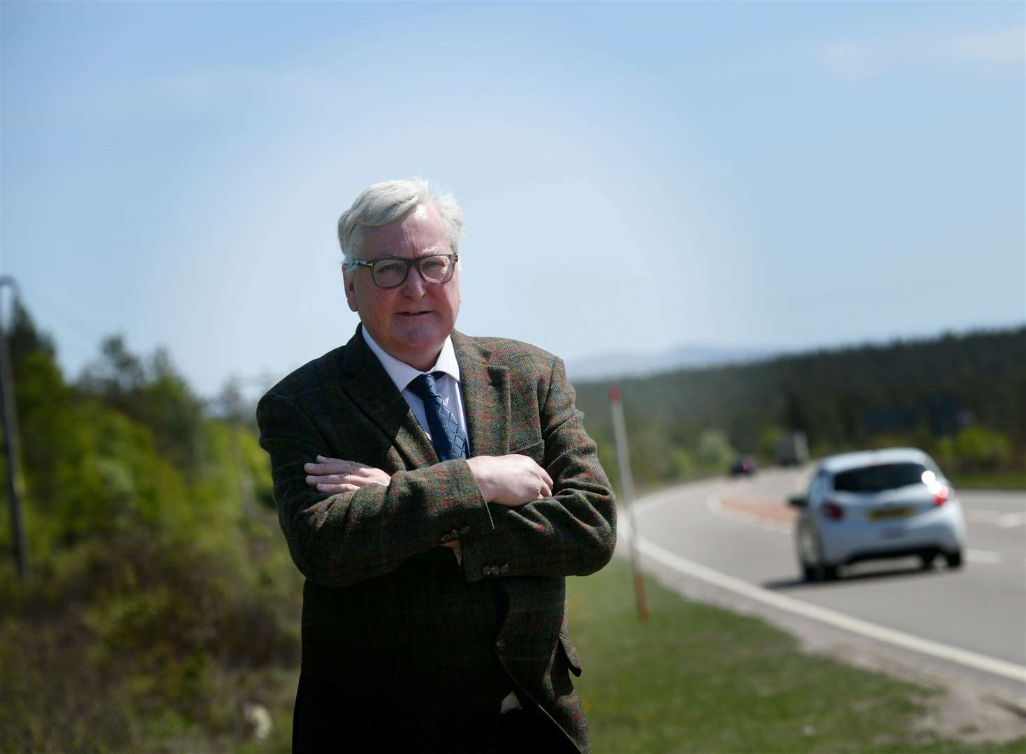 Fergus Ewing pictured near the A9 at the Carrbridge turn off - Dualling has been a significant campaign by Mr Ewing. Picture: Callum Mackay..