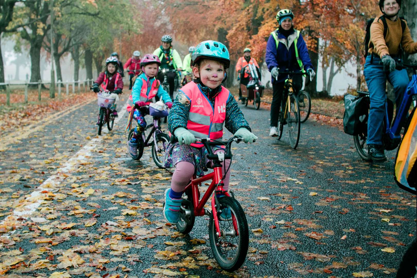 Children and their grown-ups were encouraged to wear bright colours for the autumn ride. Picture: Katie Noble